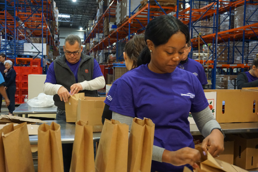 UHM Partners Volunteering at a Food Bank